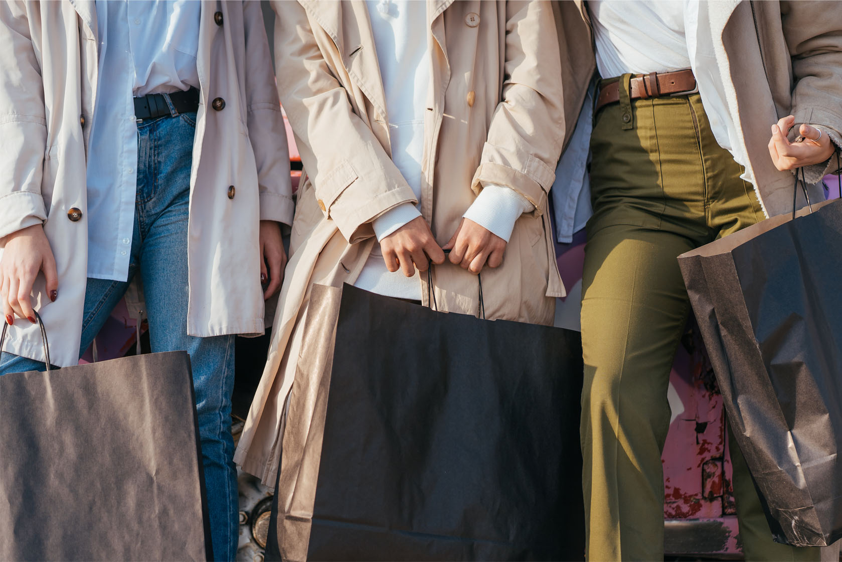 Young happy women with shopping bags